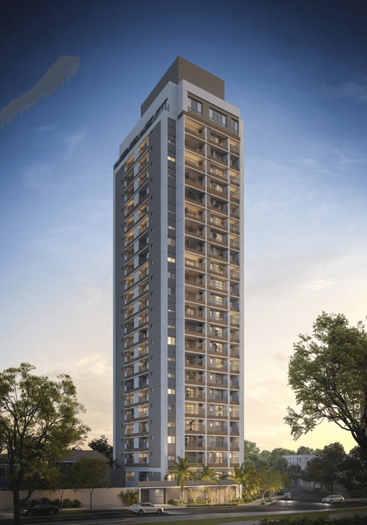 Fachada do edifício residencial de torre única com varandas e iluminação noturna.
